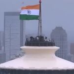 Tricolor flag flies from 605 feet tower in America